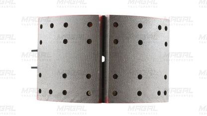 Vista frontal de balatas perforadas del kit de frenos 4711 con zapata embalatada, ideal para sistemas de frenado de vehículos pesados